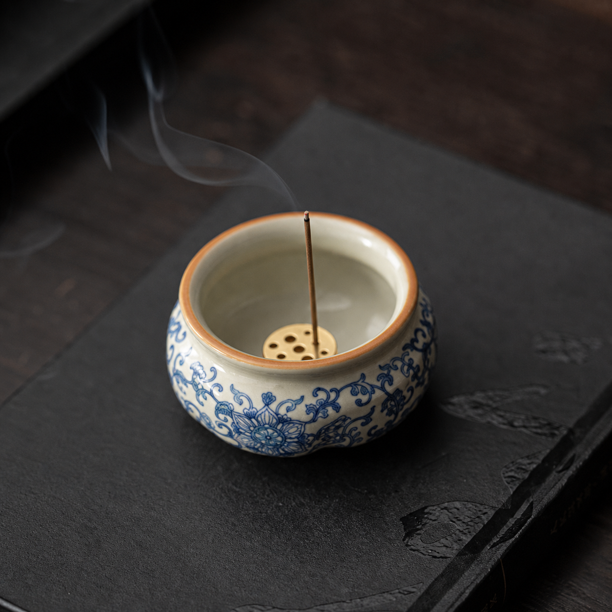 Ru Ware Lotus Incense Burner - Blue-and-White Vine with incense smoke on dark background