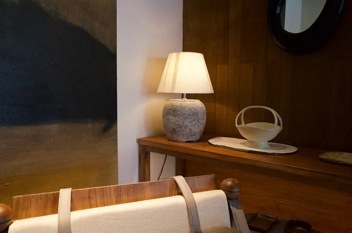 Warm bedroom corner with lamp and a quiet incense setting