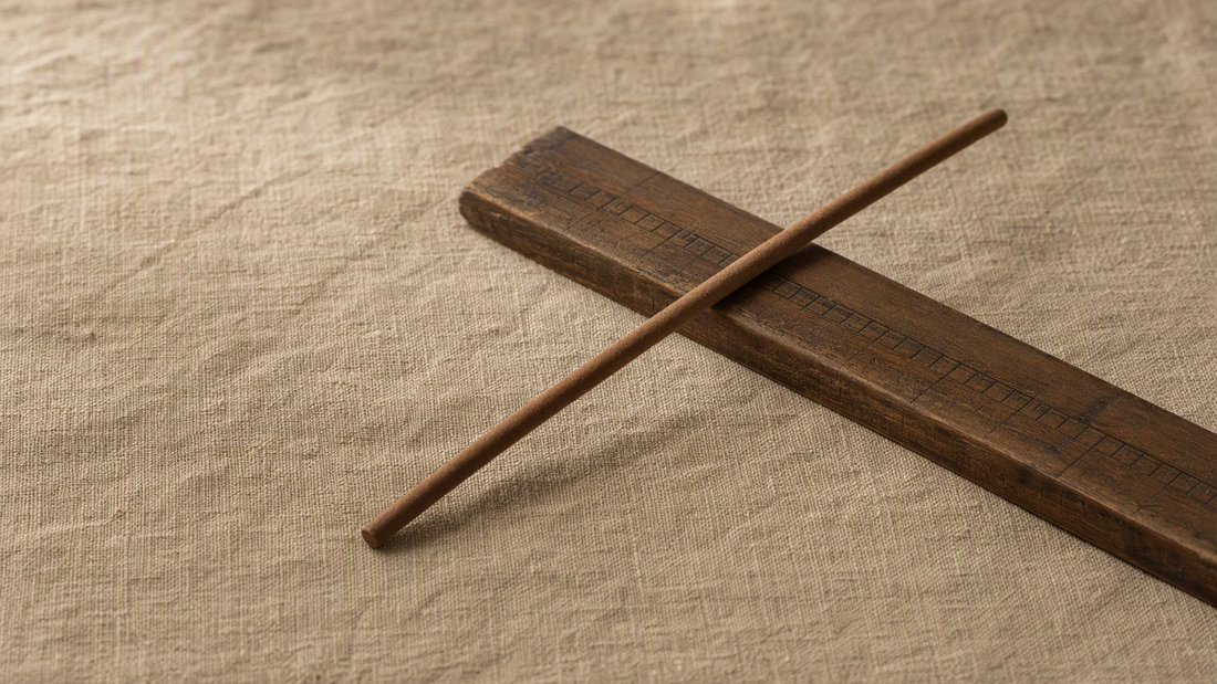 INCENZO incense stick on a traditional Chinese Luban ruler