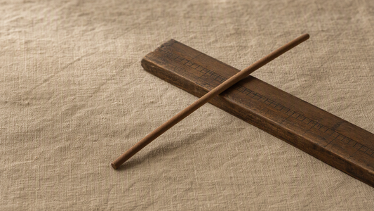 INCENZO incense stick on a traditional Chinese Luban ruler