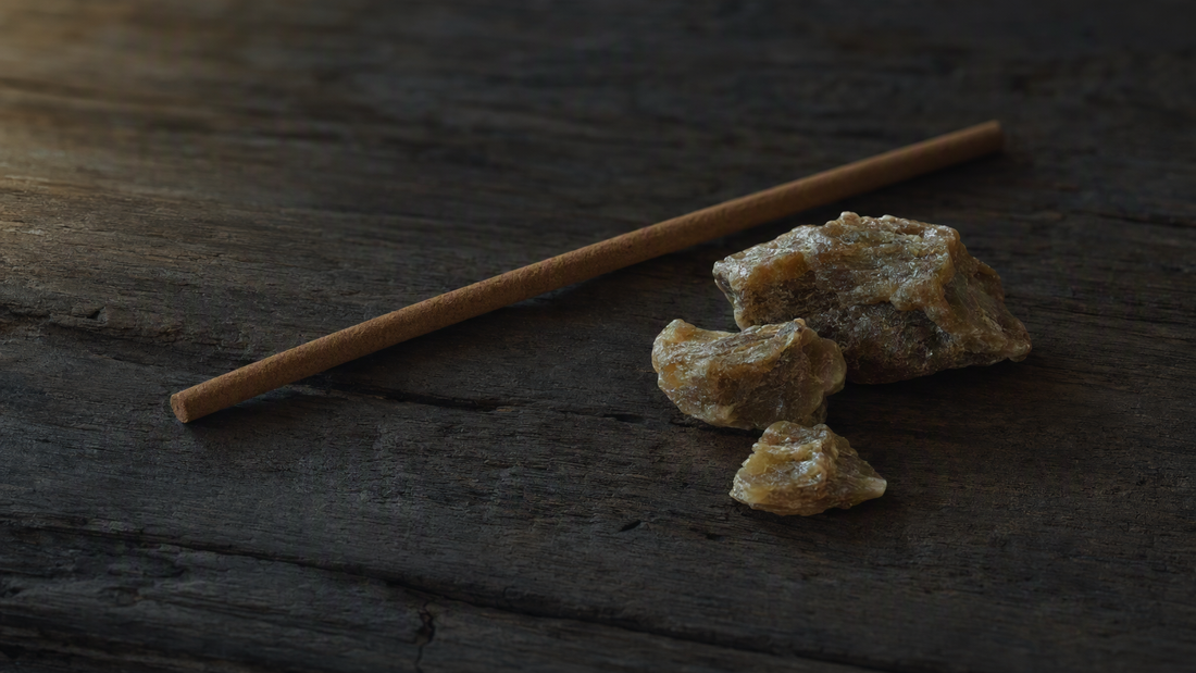 Incense stick beside natural ambergris resin still life