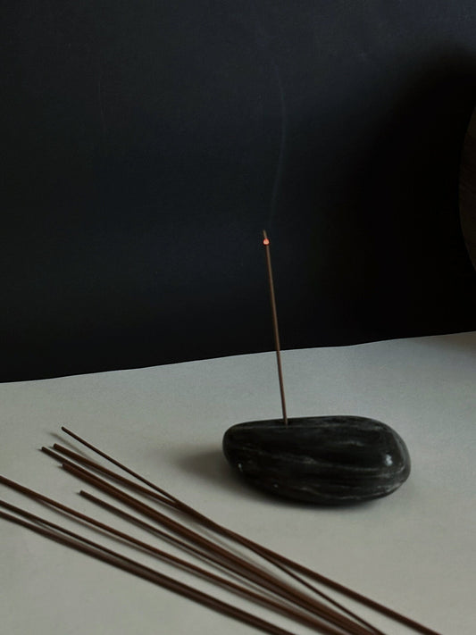 INCENZO black marble incense holder with burning incense stick