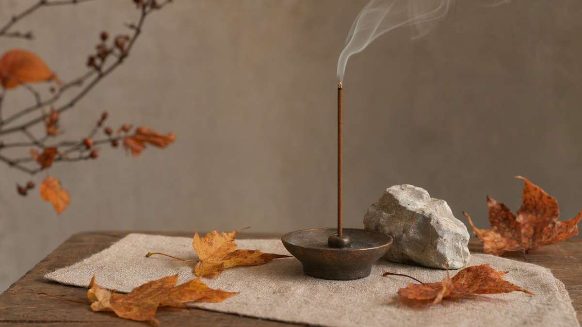 Incense with autumn leaves for fall wellness cleansing ritual