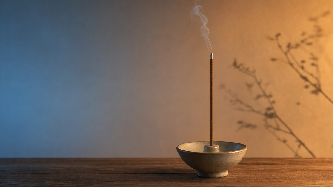 Incense burning with light suggesting different times of day