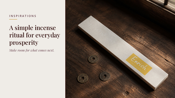 INCENZO blog header — A simple incense ritual for everyday prosperity — Enrich frankincense box beside three old copper coins on a wooden table