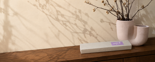 Unfold orchid incense on a walnut table in warm afternoon light for an after-work ritual