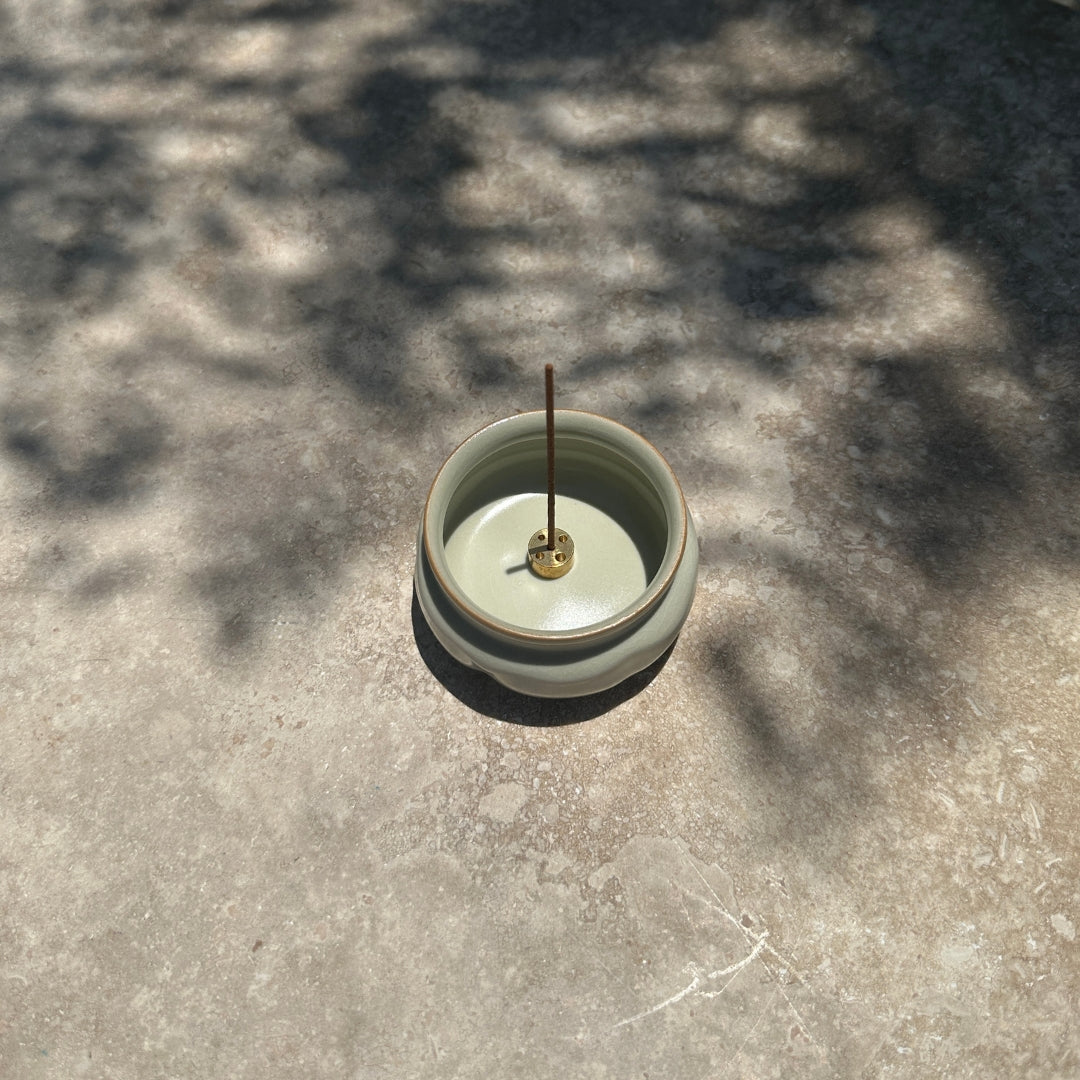 Ru Ware Lotus Incense Burner - Celadon Cream top view in dappled light