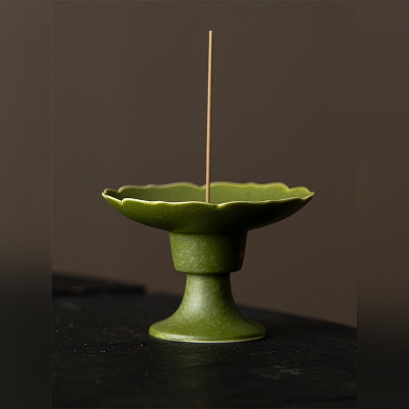 Ripple Footed Incense Dish — Green Tangerine glaze, front view with incense stick