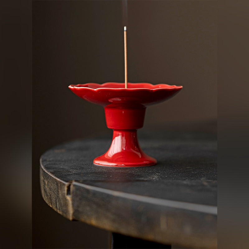 Ripple Footed Incense Dish — Palace Red glaze, front view with incense stick