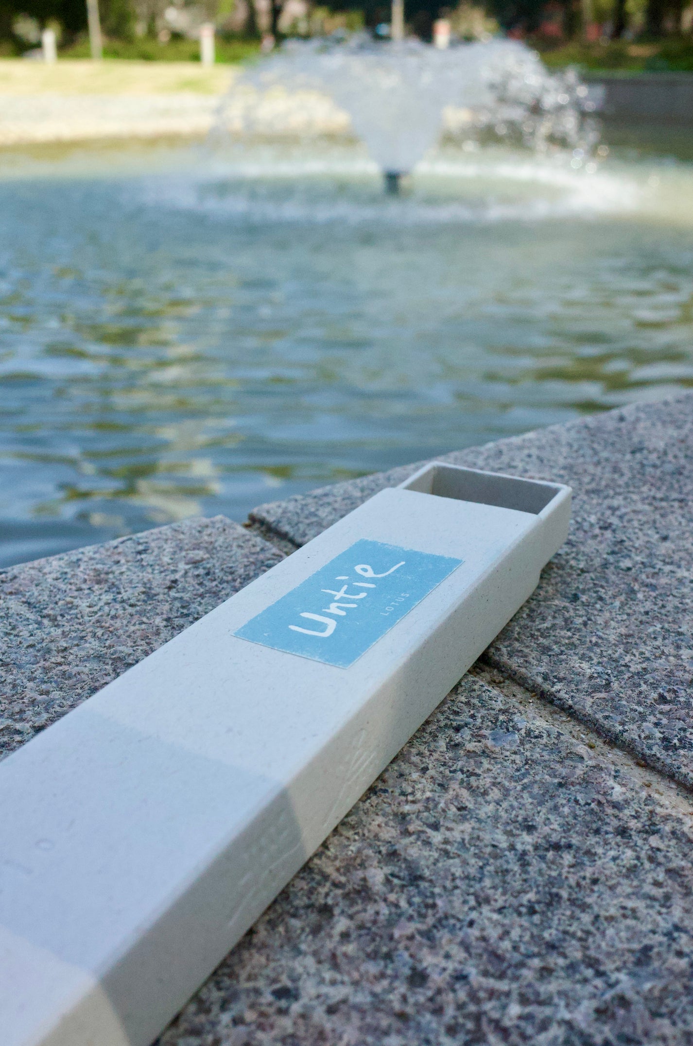 Lotus Incense in front of water fountain